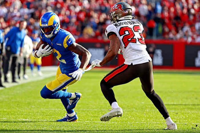 Los Angeles Rams wide receiver Van Jefferson (12) runs the ball against Tampa Bay Buccaneers cornerback Sean Murphy-Bunting (23) during the first half in a NFC Divisional playoff football game at Raymond James Stadium
